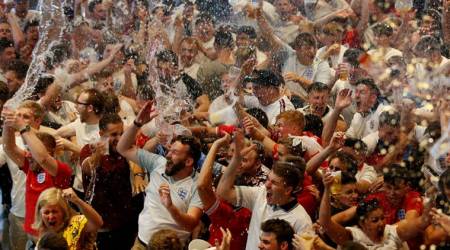 England fans celebrate during the game against Sweden