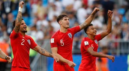 Samara :  England's Kyle Walker, left, John Stones, centre, and Jesse Lingard celebrate their victory over Sweden during the quarterfinal match between Sweden and England at the 2018 soccer World Cup in the Samara Arena, in Samara, Russia, Saturday, July 7, 2018. (AP Photo/Frank Augstein)(AP7_7_2018_000234A)