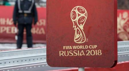 A sign with the logo of the 2018 FIFA World Cup Russia is on display near the Kremlin before the events, dedicated to the upcoming World Cup Final Draw, in central Moscow, Russia November 29, 2017. REUTERS/Sergei Karpukhin
