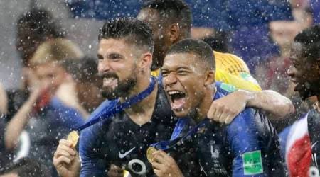 France's Kylian Mbappe, right, and teammate Olivier Giroud celebrates after the final match between France and Croatia at the 2018 soccer World Cup in the Luzhniki Stadium in Moscow, Russia