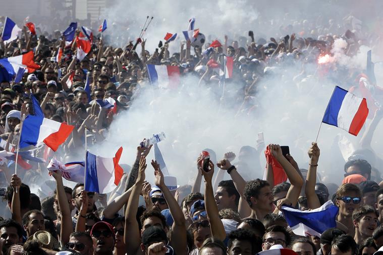 With flags, song, pride, French celebrate unifying victory