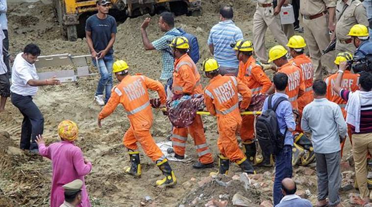 Rescue works underway after an under-construction building collapsed in Ghaziabad on Sunday. (PTI)