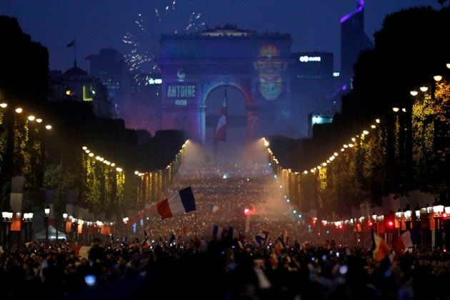 The name of French soccer striker Antoine Griezmann is projected onto the Arc de Triomphe after France won the soccer World Cup final match between France and Croatia