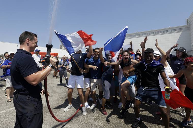 With flags, song, pride, French celebrate unifying victory