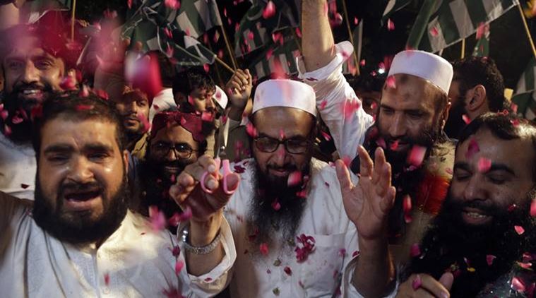 Under pressure, Pakistan books Hafiz Saeed and his aides for funding Lashkar