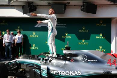 Mercedes' Lewis Hamilton celebrates winning the race