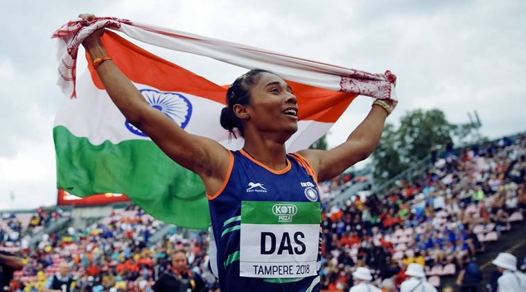 Hima Das, of India, celebrates her victory in women's 400 meter race at the 2018 IAAF World U20 Championships in Tampere, Finland