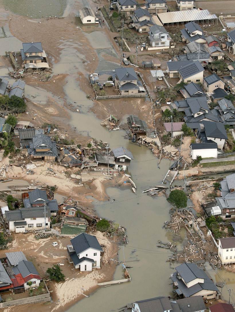 Flooding and landslides in Japan leave at least 100 dead