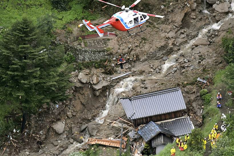 Flooding and landslides in Japan leave at least 100 dead