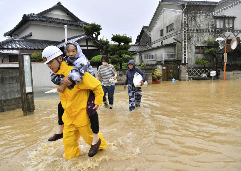 Flooding and landslides in Japan leave at least 100 dead