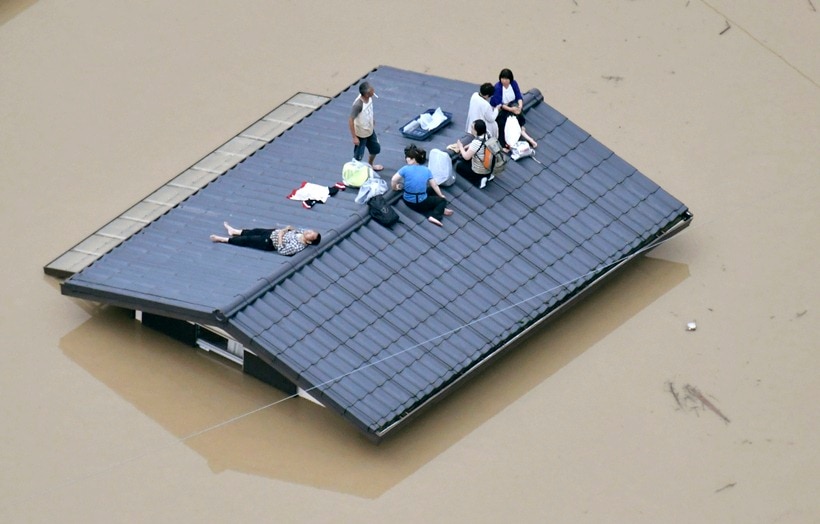 Flooding and landslides in Japan leave at least 100 dead