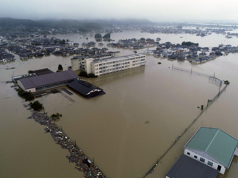 Flooding and landslides in Japan leave at least 100 dead