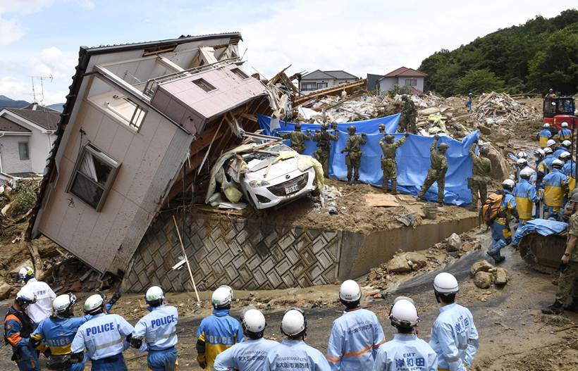 Flooding and landslides in Japan leave at least 100 dead