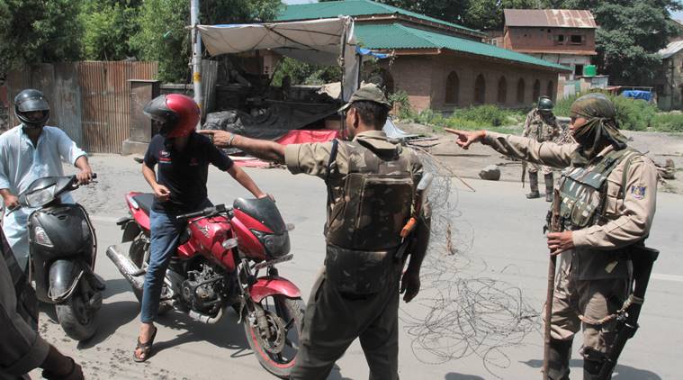 Security personnel on duty in Kulgam district of Jammu and Kashmir on Saturday. (Express photo/Shuaib Masoodi)