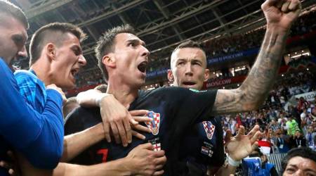Croatia's Mario Mandzukic, center, celebrates after scoring his side's second goal during the semifinal match between Croatia and England at the 2018 soccer World Cup in the Luzhniki Stadium in Moscow, Russia, Wednesday, July 11, 2018. (AP Photo/Frank Augstein)