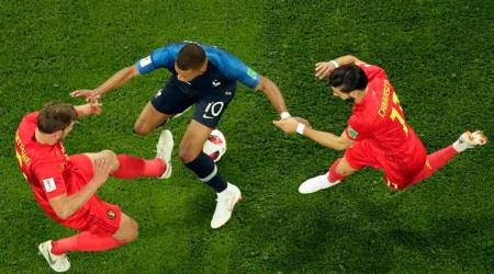 France's Kylian Mbappe, center, is challenged by Belgium's Jan Vertonghen, left and Belgium's Yannick Carrasco during the semifinal match between France and Belgium at the 2018 soccer World Cup in the St. Petersburg Stadium in St. Petersburg, Russia, Tuesday, July 10, 2018. (AP Photo/Dmitri Lovetsky)