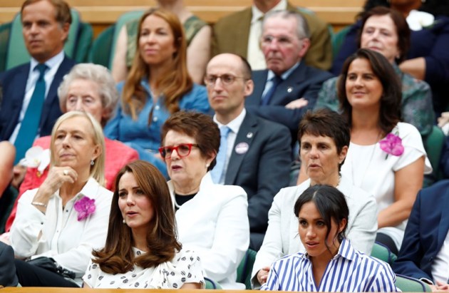 Britain's Catherine the Duchess of Cambridge and Meghan the Duchess of Sussex sit in front of Martina Navratilova and Billie Jean King at Wimbledon