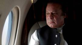 FILE PHOTO: Pakistani Prime Minister Nawaz Sharif looks out the window of his plane after attending a ceremony to inaugurate the M9 motorway between Karachi and Hyderabad Nawaz Sharif