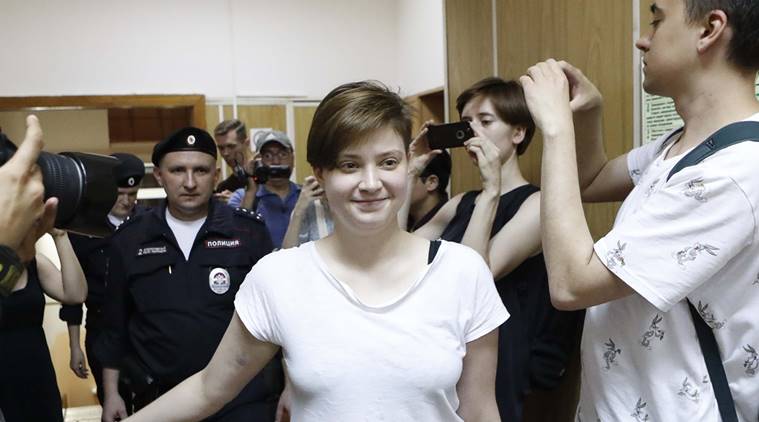 One of four intruders affiliated to anti-Kremlin punk band Pussy Riot, Olga Pakhtusova, who ran onto the pitch during the World Cup final between France and Croatia, is escorted inside a court building in Moscow