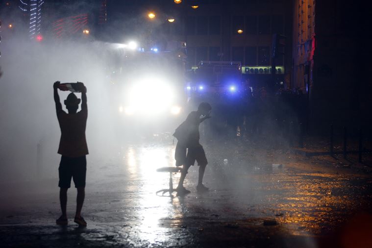 French police clash with unruly fans, clear Champs Elysees