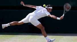 Switzerland's Roger Federer returns to Czech Republic's Tomas Berdych during their Men's Singles semifinal match at the Wimbledon Tennis Championships in London