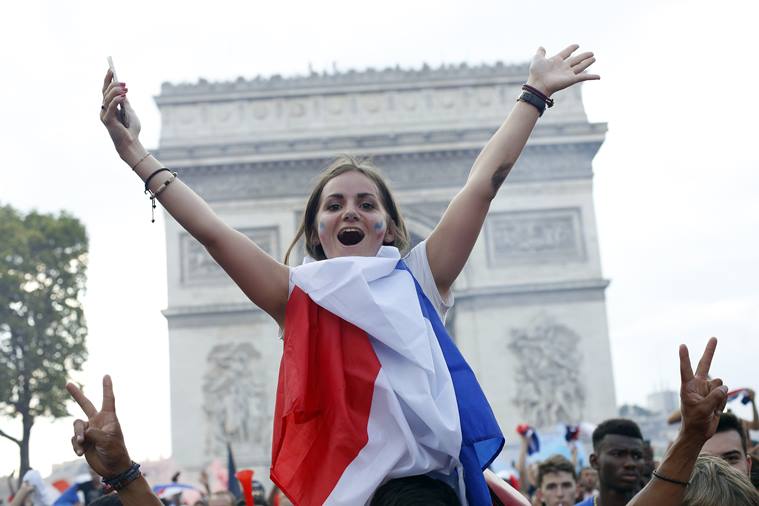 With flags, song, pride, French celebrate unifying victory