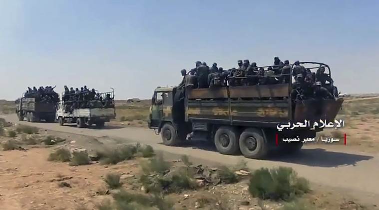 Syrian troops celebrate recapture of Jordan border crossing