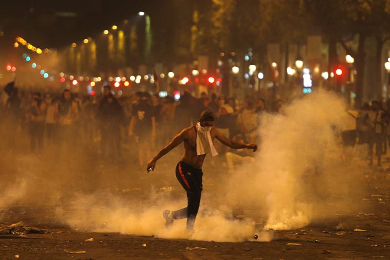 French police clash with unruly fans, clear Champs Elysees
