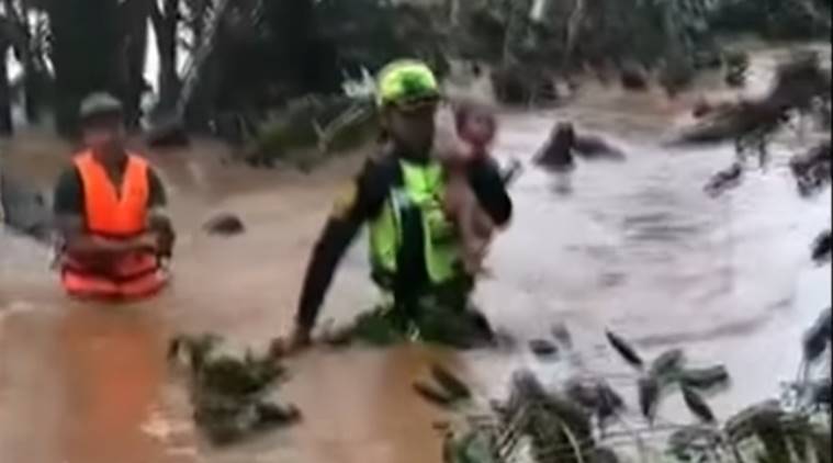baby saved Laos dam disaster, toddler saved Thai rescue team, thai rescue operation, Thai cave rescue volunteers save baby, viral video,
