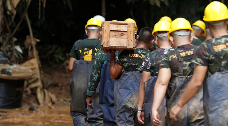 Rescuers ponder how to extract trapped team from flooded Thai cave