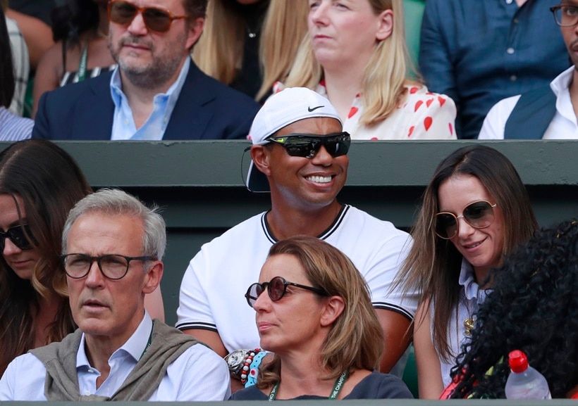 Tiger Woods sits in the player's box of Serena Williams during the women's singles final match between Serena Williams of the US and Angelique Kerber of Germany at the Wimbledon Tennis Championships