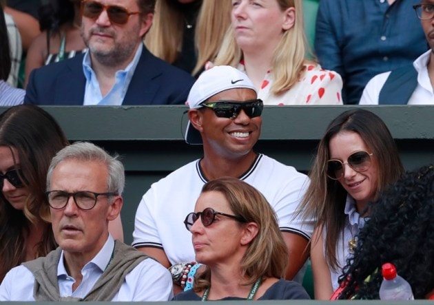 Tiger Woods sits in the player's box of Serena Williams during the women's singles final match between Serena Williams of the US and Angelique Kerber of Germany at the Wimbledon Tennis Championships