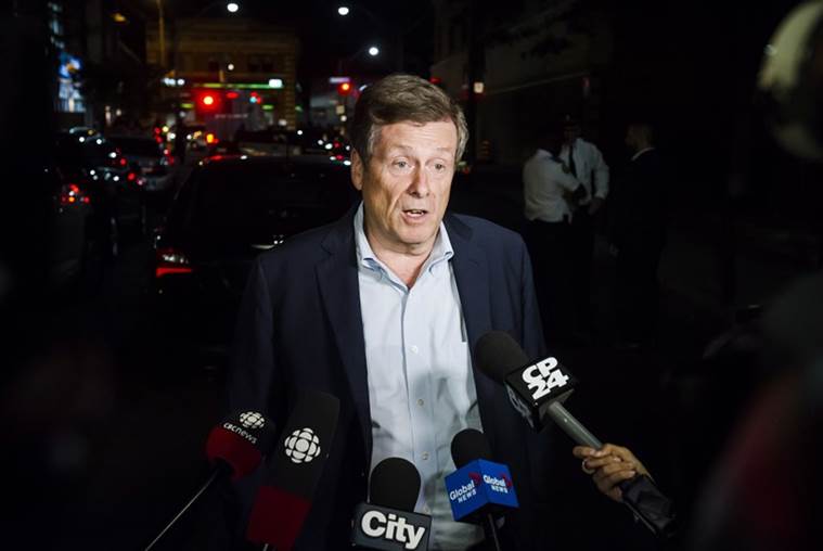 toronto shooting, 2 dead, gunman dead, 13 injured, gunman suffered mental illness, depression and psychosis, gun violence, opening shooting Toronto, World News, Indian express