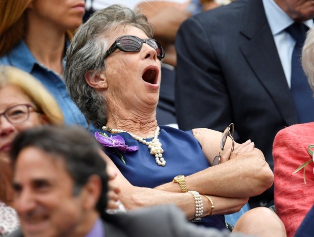 Virginia Wade yawns as she watches Serbia's Novak Djokovic play his semi final match against Spain's Rafael Nadal