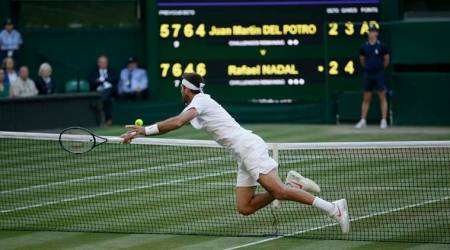 Juan Martin Del Potro of Argentina leaps for a ball during the men's quarterfinal match against Rafael Nadal of Spain at the Wimbledon Tennis Championships in London