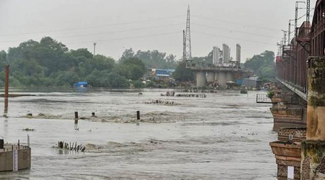A view of Yamuna river in New Delhi on Saturday. The water level in Yamuna river increased after five lakh cusec water was released from Hathnikund Barrage in Haryana. (PTI)