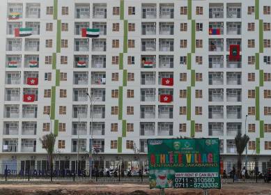 Flags are hung at an athlete village near Jakabaring Sports City ahead of the Asian Games in Palembang, South Sumatra, Indonesia