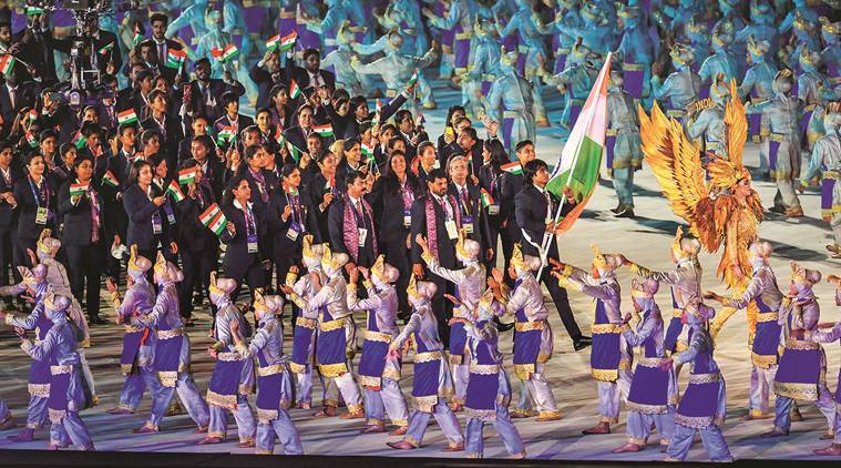 Javelin thrower Neeraj Chopra leads the Indian contingent at Gelora Bung Karno Stadium, in Jakarta on Saturday. (PTI)
