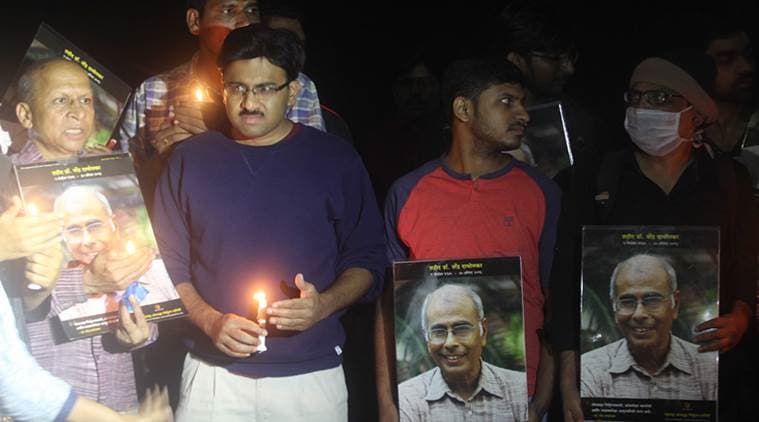 Son Hamid Dabholkar led a candle march on the eve of Narendra Dabholkar's fifth death anniversary at Vitthal Ramji Shinde bridge in Pune on Friday. (Express photo/Pavan Khengre)