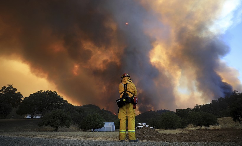 California's largest wildfire surges as temperature rises