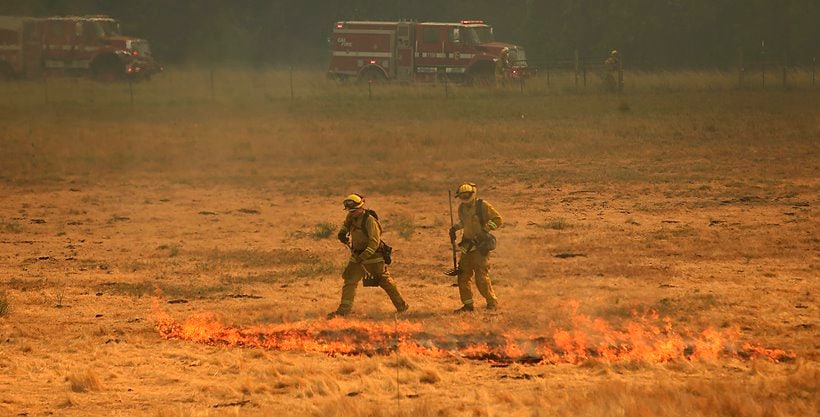 California's largest wildfire surges as temperature rises