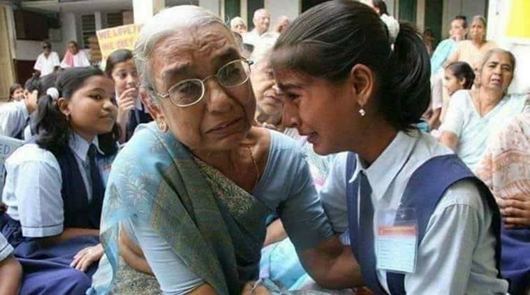 viral photo, viral photo of grandmother, crying grandmother viral photo, sad pictures, real story behind viral photo,