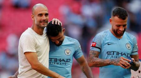 Soccer Football - FA Community Shield - Manchester City v Chelsea - Wembley Stadium, London, Britain - August 5, 2018  Manchester City manager Pep Guardiola celebrates winning the community shield with Manchester CityÕs Nicolas Otamendi and Sergio Aguero after the match  Action Images via Reuters/John Sibley