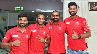 Indian hockey team captain P. R. Sreejesh (2nd R) Rupinder Pal Singh (R), Sunil Sowmarpet Vitalacharya (2ndL) and Harmanpreet Singh pose for a group photo before leaving for the Asian Games