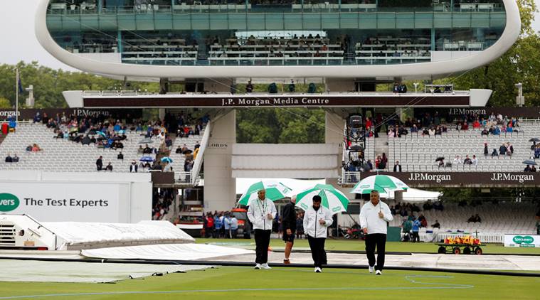 Umpires on the pitch during a rain delay at Lord's on Day 1 of second Test