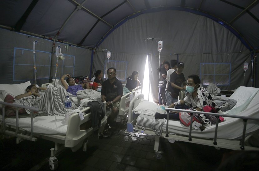 Thousands flee homes as powerful earthquake kills at least 82 on Indonesia's Lombok