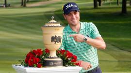 PGA golfer Justin Thomas poses with the Gary Player Cup after winning the WGC - Bridgestone Invitational golf tournament at Firestone Country Club