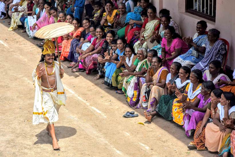 A youth dressed as King Mahabali on the occasion of Onam at St Anthony's relief camp on Friday. (Express photo/Nirmal Harindran)