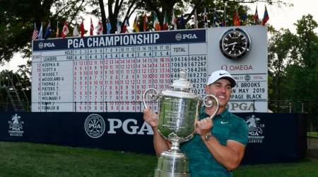 Brooks Koepka poses with the Wanamaker Trophy after winning the PGA Championship golf tournament at Bellerive Country Club.