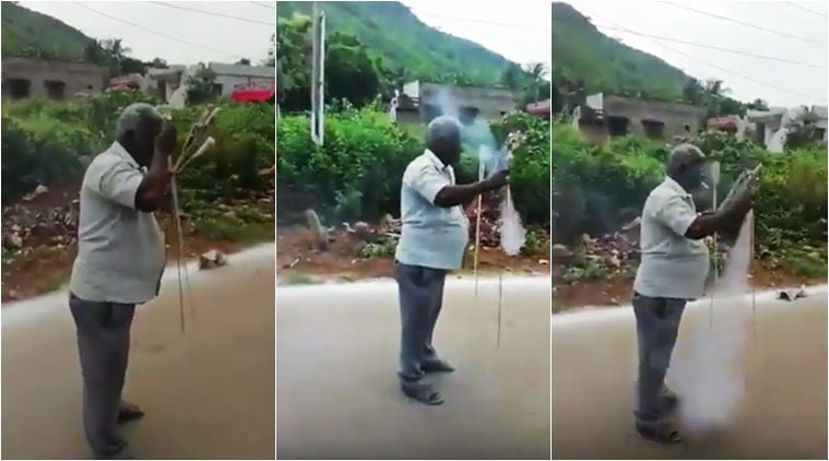 rocket, launch rocket by hand, light rocket by cigarette, indian man rocket video, man launch rocket smoking, viral news, viral videos, indian express